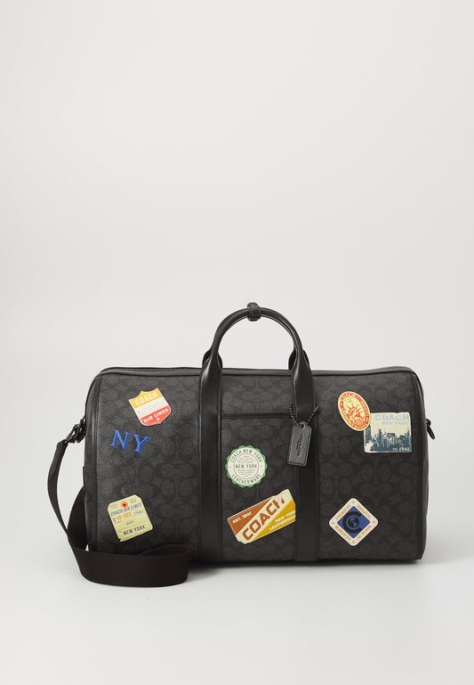 C0ACH                                 GOTHAM DUFFLE BAG 45 IN SIGNATURE CANVAS WITH PATCHES